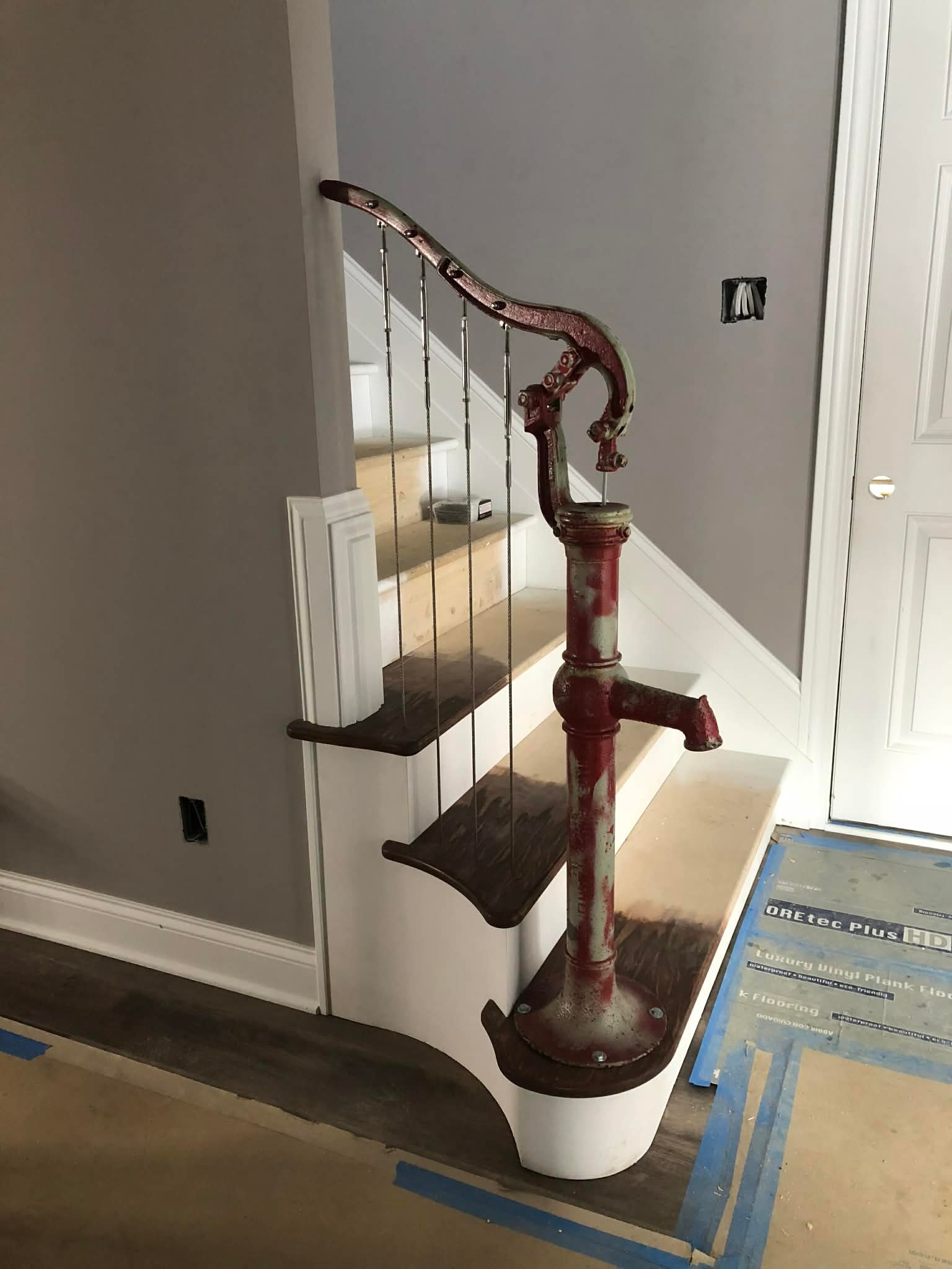 Staircase upgrade with vintage style handrail and dark stained treads